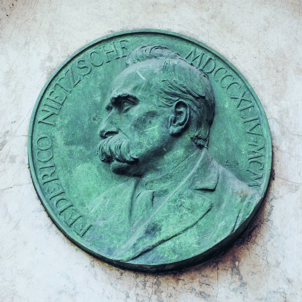 Turin, Italy - August 5, 2015: Commemorative plaque for Friedrich Nietzsche at the house where he lived in Turin